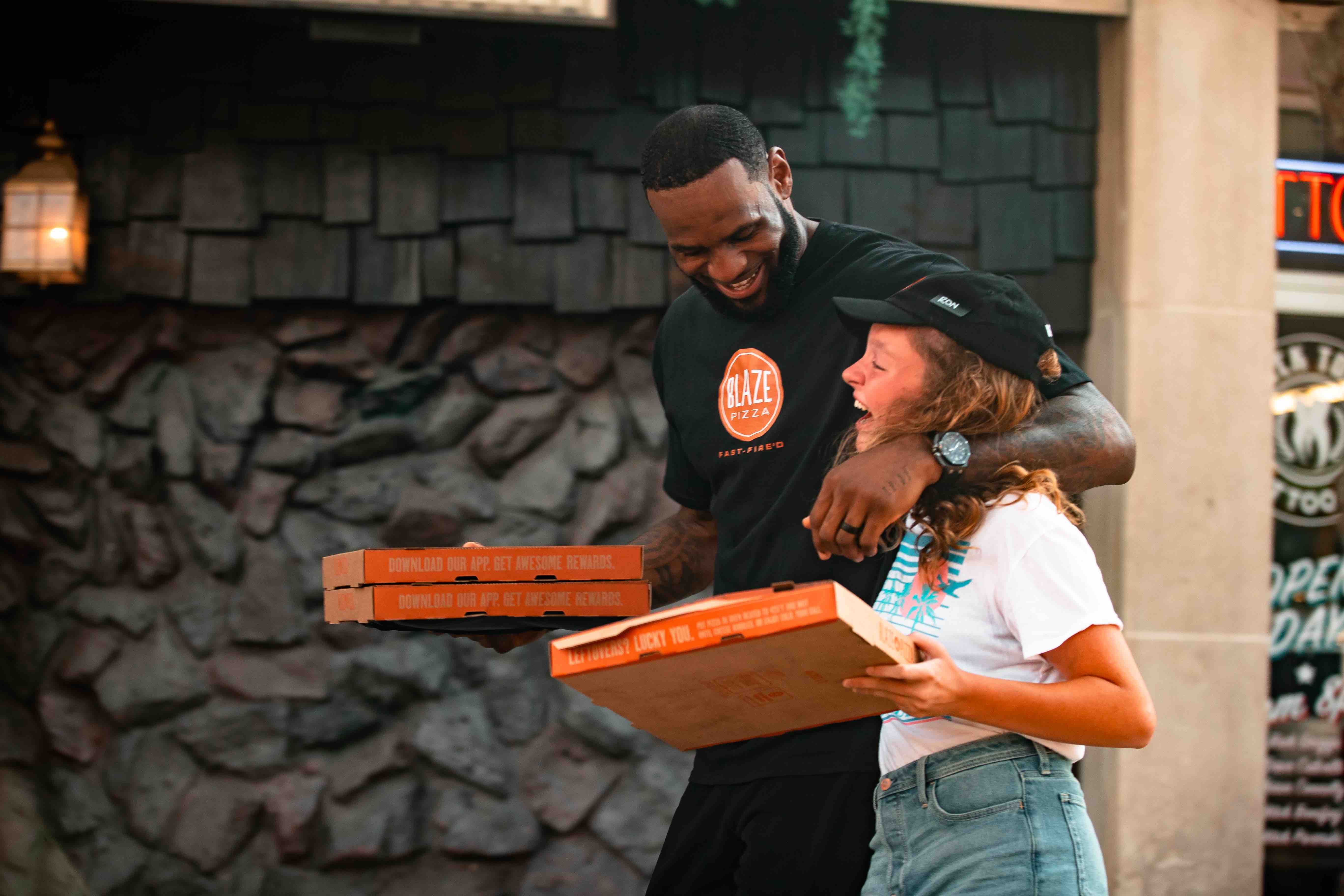 LeShip! Lakers’ LeBron James holds Pizza on the street while ‘GOAT’ pretending to be a delivery guy