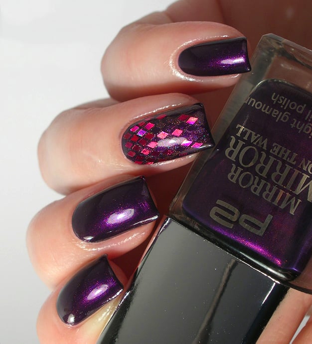 Plum-colored nails with purple and red rhombuses