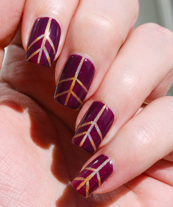 Plum nails with gold lines