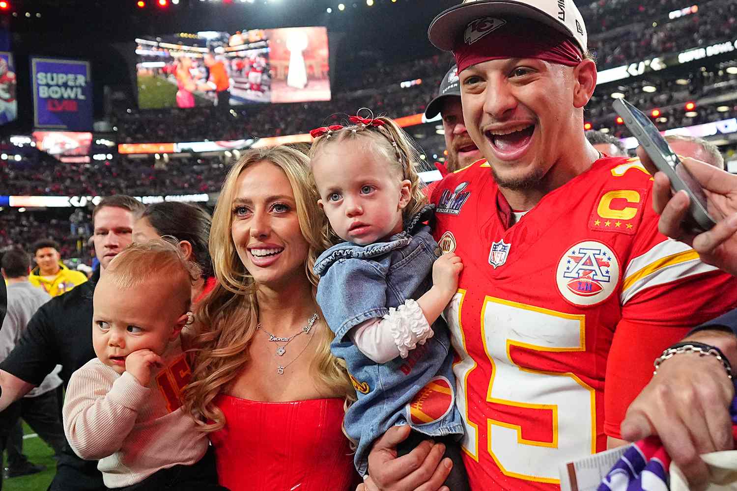 Following the Chiefs' Super Bowl victory, Brittany Mahomes, the wife of quarterback Patrick Mahomes, posts fresh photos of the couple at Disneyland and challenges the quarterback to repeat the feat: "Dad, same time next year?" - Mnews