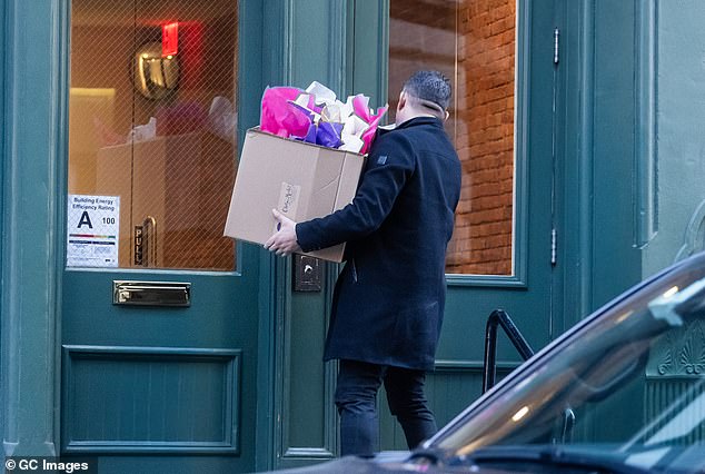 Another delivery man was spotted delivering a box full of gifts