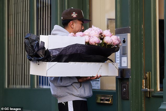 In celebration of her 34th birthday, a bouquet of two dozen pink peonies was delivered at the Long Live hitmaker's lavish penthouse in Manhattan and brought inside by her security guard