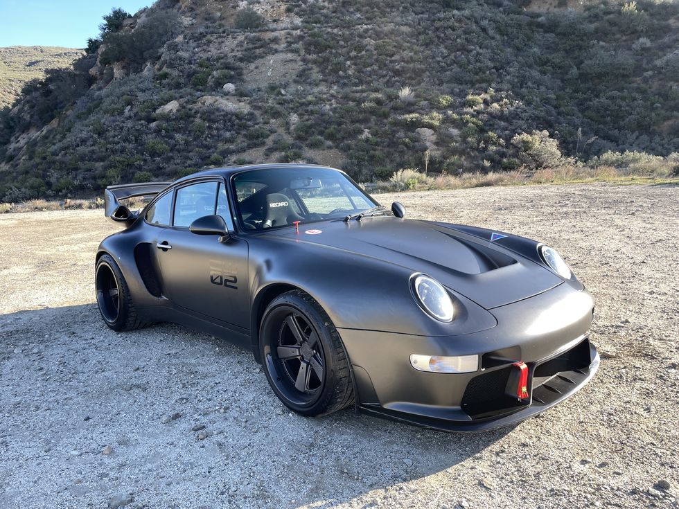 a car parked on a gravel road